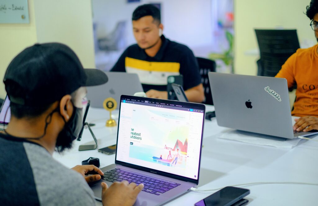 People Working on Laptops in an Office